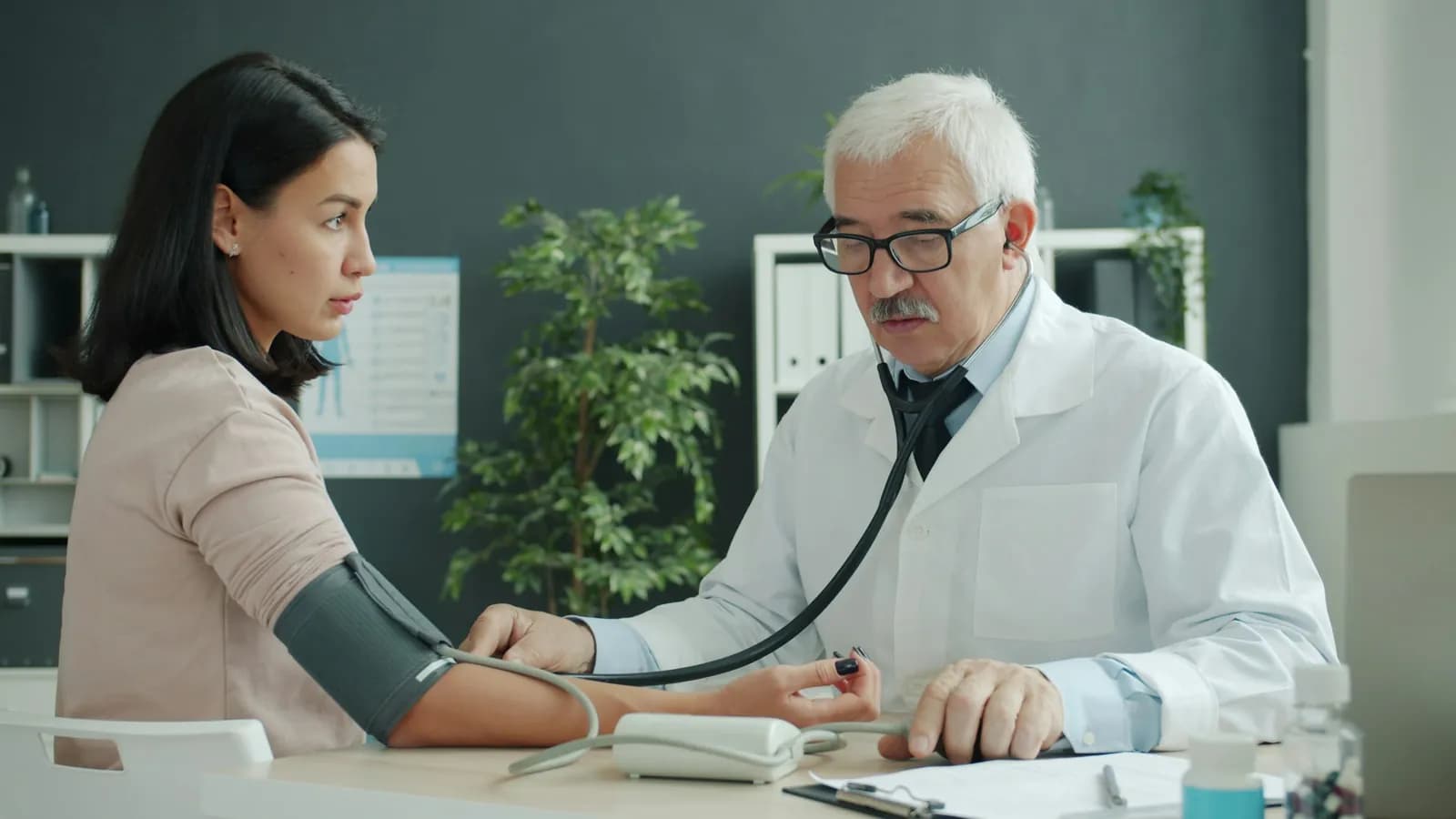 Doctor checking a patient's blood pressure