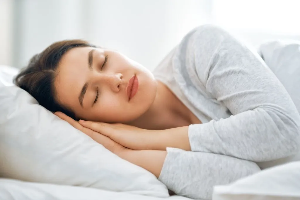 Woman sleeping peacefully on her side